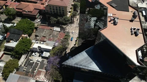 Aerial tilt down side of skyscraper in downtown Guatemala City Stock Footage 329455210