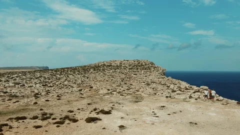 Aerial tilt down view off a cliff on the sea on the island of Lampedusa (Italy) Stock Footage 118946807