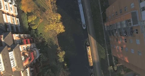 Aerial tilt down view over the grand union canal in West London Stock Footage 70796509