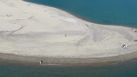 Aerial Tilt Down View of Sandy Beach and Turquoise Sea Water Stock Footage 341232534