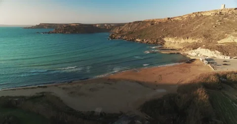 Aerial tilt up from green cliffs to blue Mediterranean  ocean Stock Footage 67163641