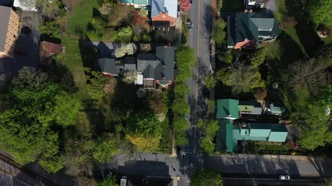 Aerial tilt up from looking straight down onto roofs and then looking at all of Stock Footage 129642710