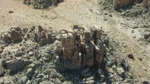 Aerial Tilt Up Pull Out Valley of Rock Formations with Other Worldly Look. Stock Footage 119149441