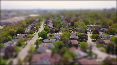 Aerial tilt shift hyperlapse over an affluent residential neighborhood. Stock Footage 131000313