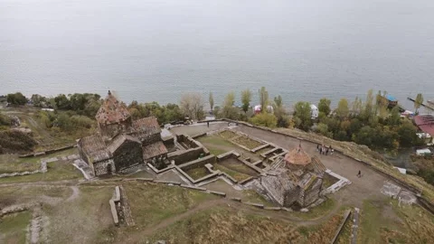 Aerial tilt up view Sevanavank monastic complex and Sevan lake. Lake Sevan .. Stock Footage 290433997