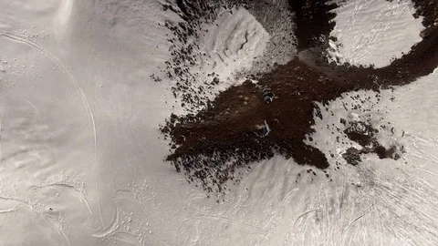 Aerial tilt up view of a small volcanic crater on mount Etna in Sicily (Italy) Stock Footage 103619255