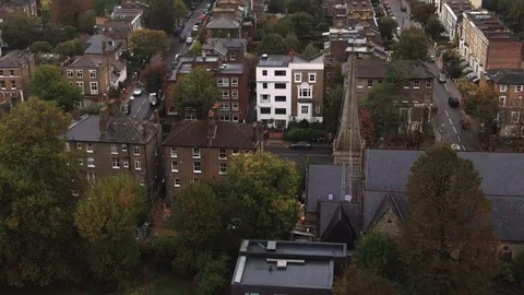 Aerial tilt up view of a Victorian village in South London Stock Footage