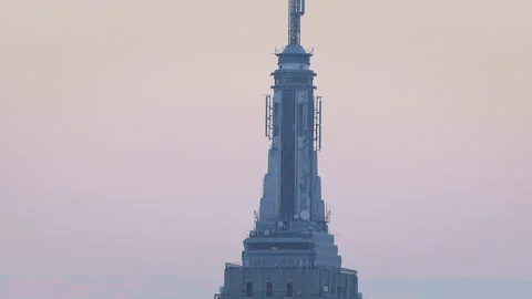 Aerial tilting down Empire State building at cool dusk Stock Footage 135947440