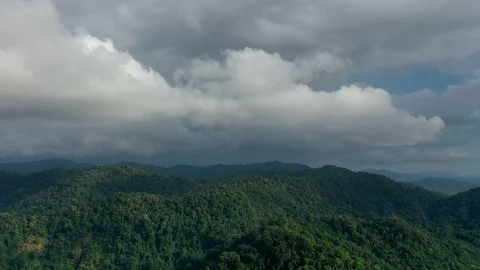 Aerial time lapse of clouds forming above mountain forest Stock Footage 124686603
