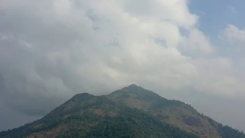 Aerial time lapse of clouds forming over mountain Stock Footage 125066025