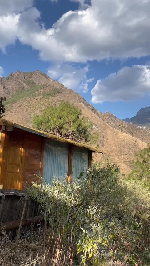 Aerial Time-lapse of Clouds Moving Over a Cabin in the Highlands Stock Footage 330105269
