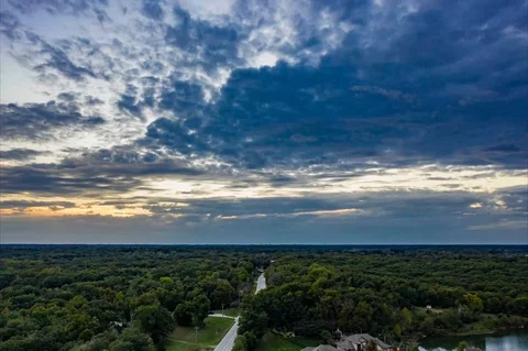 Aerial time lapse of clouds over forest Stock Footage 111591393