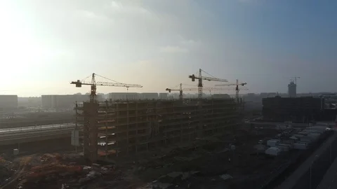 Aerial time lapse of Crane moving on a building construction site Stock Footage 126097933