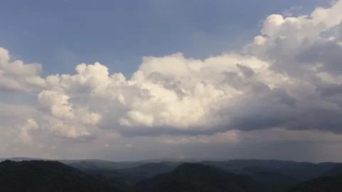 Aerial time lapse of developing clouds, over hills Stockbeeldmateriaal 205507462