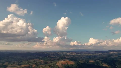 Aerial time lapse of developing clouds, over hills Stockbeeldmateriaal 205507479