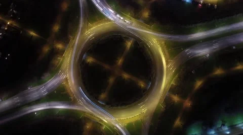 Aerial time lapse directly above roundabout in the UK at night Stock Footage 58554548