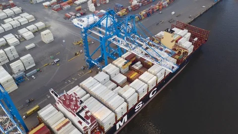 Aerial Time Lapse of Loading &amp; Unloading of Cargo Ship Stock Footage 96320533