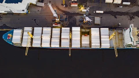 Aerial Time Lapse of Loading &amp; Unloading of Cargo Ship Stock Footage 96476064