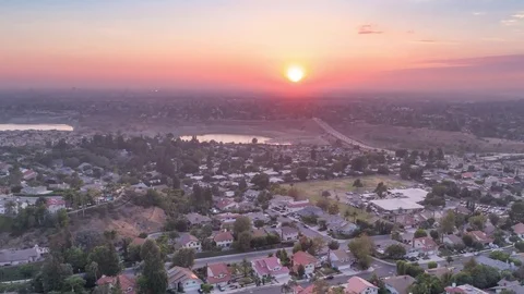 Aerial time lapse in motion at sunset over city Stock Footage 79517110