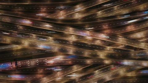 Aerial time lapse multi-level expressway road at night, junction intersection Stock Footage 169824604