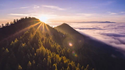 Aerial Time Lapse of Sunlit Mountain Landscape Stock Footage 312112072