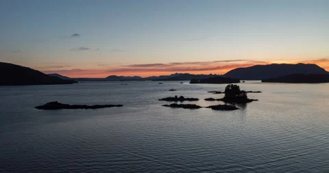 Aerial time lapse of sunset over ocean and islands Stock Footage 165258633
