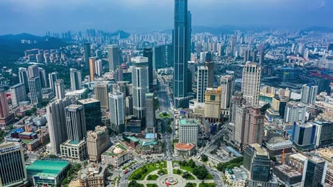 Aerial Time Lapse of Traffic Flow and Cityscape at Zhongshan Square, Dalian Stock Footage 304307435
