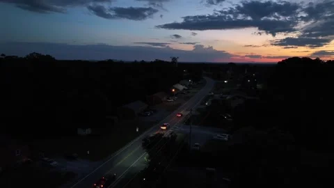 Aerial time lapse of traffic on suburb street in American neighborhood at Stock Footage 316731404