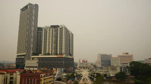 Aerial time-lapse view during dawn of "Eye Of Malacca" ferris wheel Stock Footage 53880317