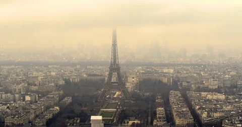 Aerial time lapse view of the Eiffel tower at sunset with fog Stock Footage 70795123