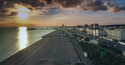 Aerial time lapse view of the seafront in Brighton before sunset with lens flare Stock Footage 80165735