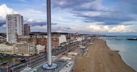 Aerial time lapse view of the seafront and the beach in Brighton and Hove Stock Footage 80420380
