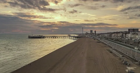 Aerial time lapse view of the seafront in Brighton at sunset Stock Footage 80421021