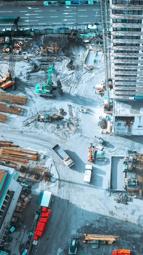 Aerial timelapse of an active construction site with heavy machinery and Stock Footage 341329628