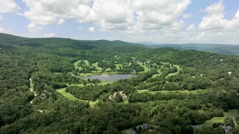 Aerial Timelapse Cloud Shadows over Golf Course and Pond Stock Footage 246536091