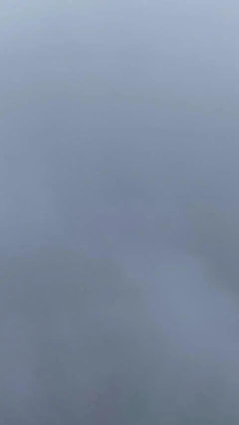 Aerial Timelapse of Clouds Clearing to Reveal Forest, Lake, and Rural Buildings Stock Footage 337234256