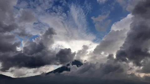 Aerial timelapse of clouds surrounding a volcano Stock Footage 252546748