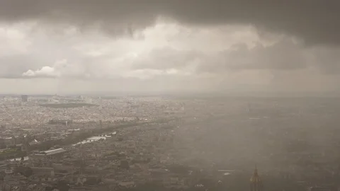 Aerial timelapse of dramatic rainy clouds covering Paris city Stock Footage 118426311
