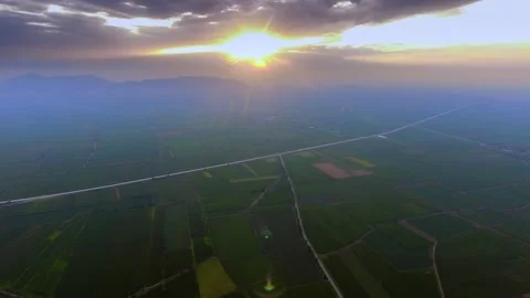 Aerial timelapse drone captures sunset above French farmland on vast flat 库存影片 333750993