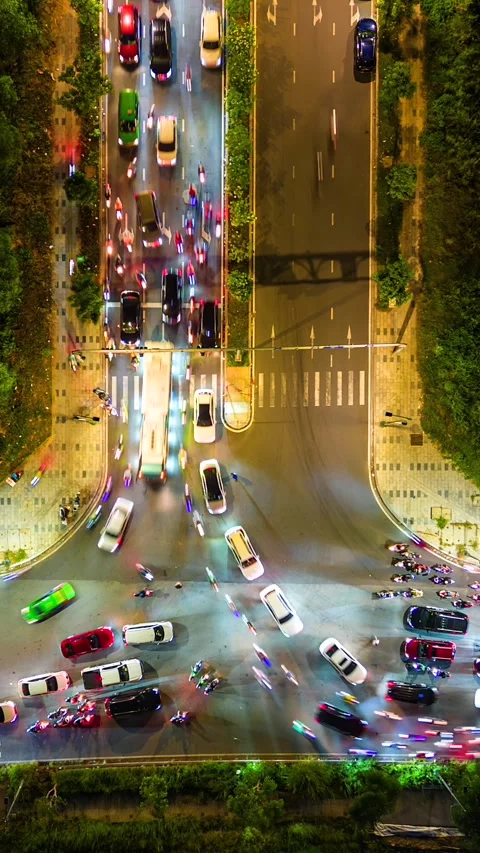 Aerial timelapse of evening traffic at intersection in Ho Chi Minh City, Vietnam Stock Footage 259494448