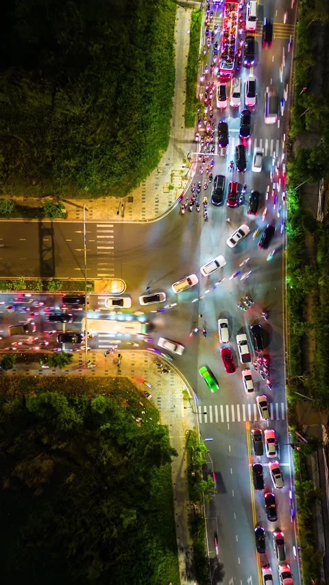 Aerial timelapse of evening traffic at intersection in Ho Chi Minh City, Vietnam Video stock 306516468