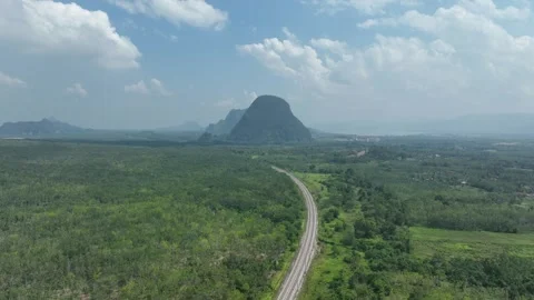 Aerial Timelapse of with hill and train crossing Stock Footage 308917396