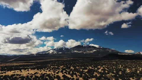 Aerial timelapse hyperlapse of clouds over mountains in the desert Stock Footage 127332676