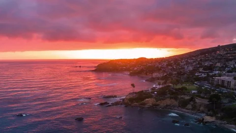 Aerial timelapse in motion (hyperlapse) at sunset with orange skies over ocean. Stock Footage 78120247