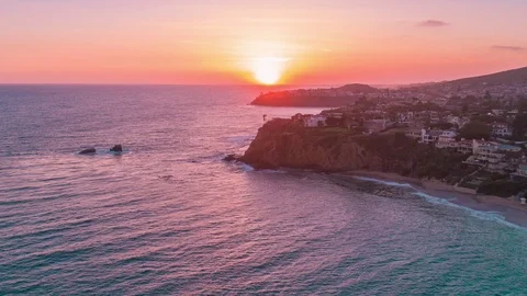 Aerial timelapse in motion (hyperlapse) at sunset with orange skies over ocean Stock Footage 78122212
