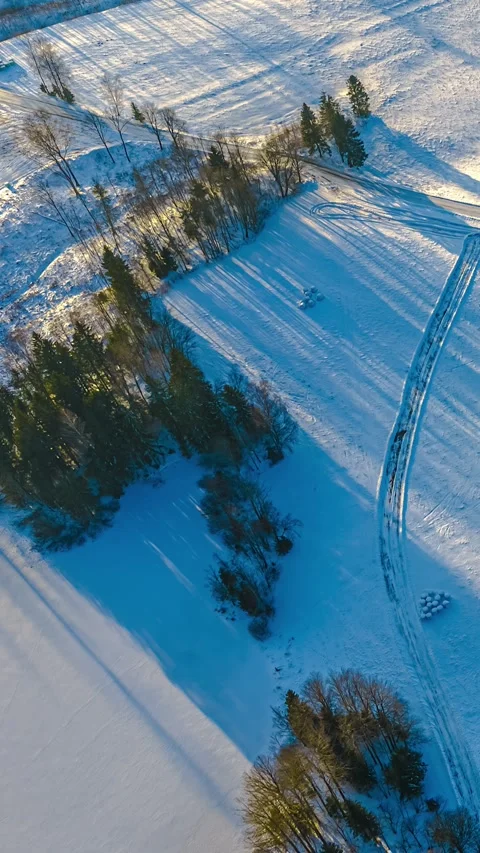 Aerial Timelapse Of Snow Covered Field With Long Winter Shadows Stock Footage 340051971