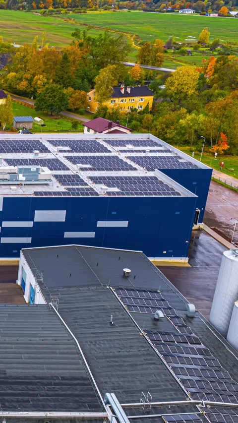 Aerial Timelapse of Solar Panel Covered Factory Roofs and Silos in Autumn Stock Footage 341706898