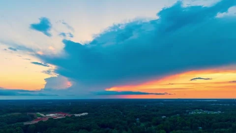 Aerial Timelapse of Summer Storm Moving Across Olive Branch MS at Dusk Video stock 337263420