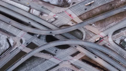 Aerial timelapse traffic jam interchange road cars driving busy junction highway Stock Footage 169296399