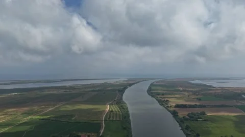 Aerial Timelapse View of River Delta, Farmland Fields and Moving Clouds 库存影片 341529627